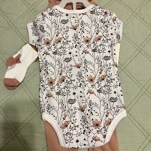Onesie, with matching pants, a bib, and a pair of socks. NWT